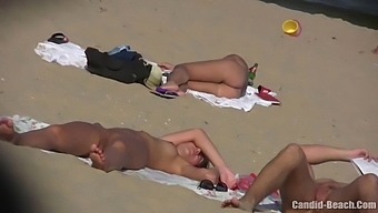 Hidden Camera Captures Uninhibited Nudist Beach Antics Of Passionate Couple