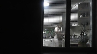 A Voyeuristic Neighbor Catches A Glimpse Of His Neighbor'S Naked Kitchen Antics Through An Open Window